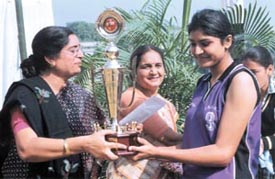 Salwan girls captain Nirjala receiving the Inter-School Volleyball Trophy from Salwan School principal Mrs Mangla Sahni