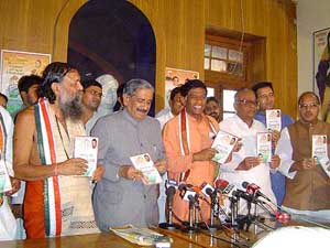 Chhattisgarh Chief Minister Ajit Jogi, senior Congress leader RK Dhawan and others release the party manifesto for the assembly elections at Raipur on Friday.