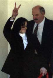 Entertainer Michael Jackson departs from the Santa Barbara County Sheriff Headquarters after being booked on child molestation charges in Santa Barbara