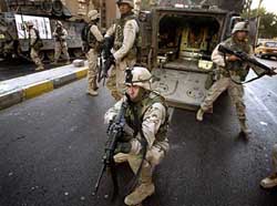 US soldiers arrive at the site of morning attacks in central Baghdad 