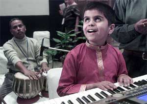 Diwakar Sharma, a physically challenged boy, performs at the first World Conference on Children's Concern in New Delhi 