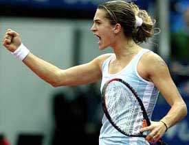 Amelie Mauresmo of France celebrates her victory over Lisa Raymond of the US in their Federation Cup final match in Moscow 
