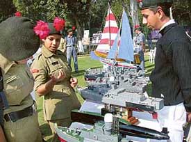 NCC cadets take a close look at models during an exhibition organised to mark 55th anniversary of the NCC