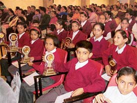 Students of Bharatiya Vidya Mandir with their trophies at the annual day prize distribution function held in Ludhiana