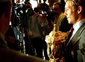 England's Jonny Wilkinson holds Rugby World Cup trophy as he faces the media in Sydney 