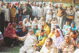 Ms Jal Kaur (centre), who was reportedly beaten up by the police