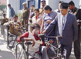 Haryana Governor Babu Parmanand distributes tricycles