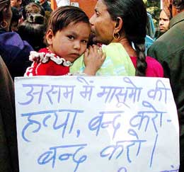 A woman belonging to the Uttar Pradesh Bihari Mahasangh takes part in a demonstration along with her daughter in New Delhi on Tuesday.