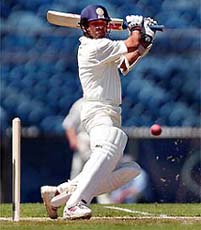 Sachin Tendulkar of India cuts a delivery on his way to 80 runs during the three-day match against Victoria at the Melbourne Cricket Ground, Melbourne