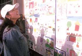 Manisha Koirala admiring the paintings which were exhibited by children of Prayas in the Capital