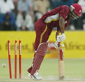 West Indies batsman Brian Lara is clean bowled by Zimbabwean skipper Heath Streak
