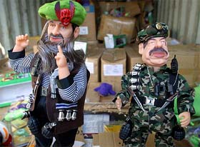 Dolls of Osama bin Laden and Saddam Hussein are displayed at the Israeli border customs office in the port of Haifa on Wednesday