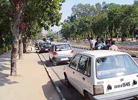 Vehicle rush flows on to the roads for parking in the wake of inadequate space