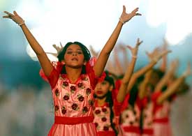 Girls dance during the opening ceremony for the FIFA World Youth Soccer championships in Abu Dhabi