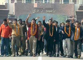 Members of the Pakistan hockey club cross over to India at the Wagah check post