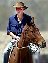 Britain's Prince Harry rides his horse Guardsman at Tooloombilla station in central Queensland