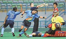 Deepak Thakur and Baljit Singh Dhillon exult after scoring a goal
