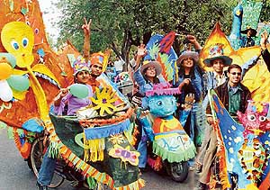 Students of Government College of Art, riding their colourful floats, which reflect the true spirit of the city