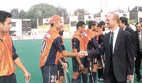 Indian Oil star player Prabhjyot Singh being introduced to chief guest Kamal Chaudhary in the Shastri Hockey Tournament at the Shivaji Stadium