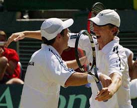 Australian players Todd Woodbridge and Wayne Arthurs embrace after their doubles victory over Spain during the Davis Cup final in Melbourne