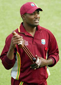 West Indies captain Brian Lara holds the series trophy after beating Zimbabwe 3-2 in the five-match one-day series at the Harare Sports Club on Sunday