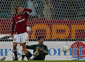 AS Roma's Francesco Totti celebrates after scoring as Lecce's goalkeeper Marco Amelia looks on during their Serie A clash at the Olympic stadium in Rome on Sunday