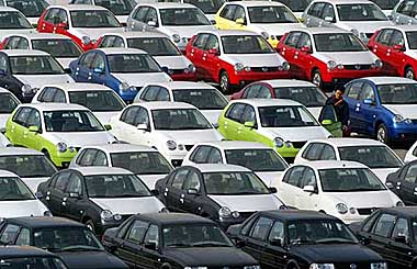 Rows of cars wait for delivery at an auto sales company parking lot in Shanghai 