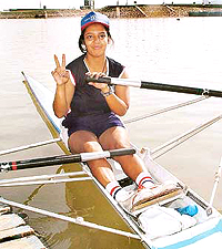 Sharmistha Basu of Calcutta University shows the victory sign after winning the single scull race during the All-India Inter-University Rowing Championship at Sukhna Lake in Chandigarh on Thursday.
