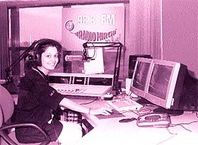 A radio jockey gets ready for work
