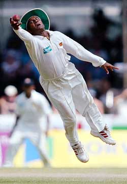Hashan Tillakaratne takes a catch from England's Mark Butcher during the third day's play of the first Test
