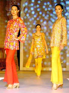 Models display the creations of fashion designers' collections at Khalsa College at Amritsar Heritage Festival on Saturday
