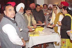 Dissident Punjab Congress MLAs share sweets after deposing before the three-member AICC panel in the Capital