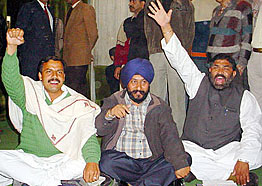 Panther Party MLAs Balwant Singh Mankotia and Faqir Nath along with Manjeet Singh of the BSP sit in dharna in the lobby of the Jammu and Kashmir Assembly in protest against discrimination with Jammu on the opening day of the winter session on Wednesday