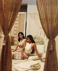 Models pose for a photo session during a Press meet of  'Tantavi 2003' 