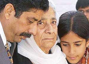 Uday Singh's father, Col P.M. Singh, grandmother, Ms Anup Kaur and sister Bani mourn at Uday's funeral in Chandigarh 