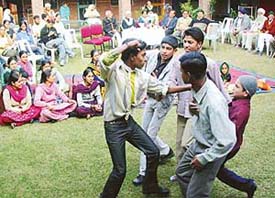 Juvenile delinquents at the Old Age Home in Sector 15 present an item to entertain inmates of the home in Chandigarh on Thursday.