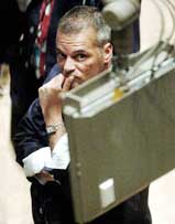 A trader at the New York Stock Exchange watches the early numbers on a monitor  on Monday