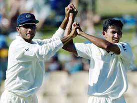 Ajit Agarkar is congratulated by captain Sourav Ganguly after he dismissed Stuart MacGill to end the Australian second innings and finish with six wickets on the fourth day of the second Test in Adelaide on Monday