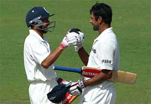 Ajit Agarkar, left, congratulates Rahul Dravid after he hit the winning run