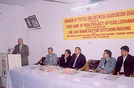The State Bank of India, Ludhiana, presents a button-stitching machine to the Knitwear Training Centre at a function to mark the centres anniversary