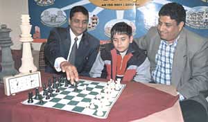 Jadoube: Parimarjan Negi makes a careful move with Pradeep Jain while Bharat Chauhan of Delhi Chess Association looks on at the Russian Culture Centre in New Delhi on Thursday.