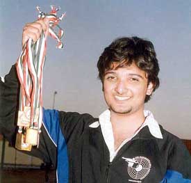 Ronak Pandit of Maharashtra holds his gold medals 