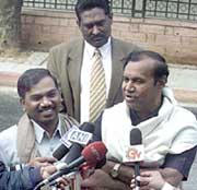 Union Ministers from the DMK, Mr T.R. Balu and Mr A. Raja, talk to the media outside Prime Minister Atal Bihari Vajpayees residence after submitting their resignation letters to him in New Delhi on Sunday