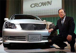 Toyota Motor Corp. Chief Executive Officer Fujio Cho poses with the renewed Crown model, Crown Athlete