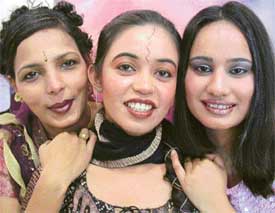 City girls decked up in gold, silver and copper for a New Years eve bash at a cosmetics centre