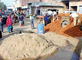 A chowk at Mullanpur-Garibdass village, Kharar, being repaired with financial assistance from Punjab National Bank and kar seva