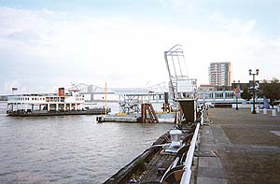 Mississippi flows past USS Kidd, a World War II destroyer, harboured permanently as a memorial