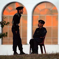 Security officials keep guard at dusk outside the convention centre in Pakistan's capital of Islamabad on Sunday. The convention centre is the main venue for the upcoming South Asian Association for Regional Cooperation (SAARC) summit from January 4 to 6. 