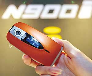 NTT DoCoMo’s FOMA 900i series mobile phone is shown at a presentation in Tokyo.