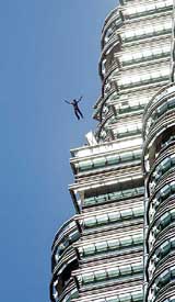 Australian Steve Anderton leaps from the world's highest building, Petronas Twin Towers, during the Malaysian International Championship of Extreme Skydive